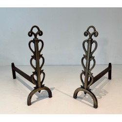 Pair of Brass and Iron Andirons with Stacked Scroll-Column Uprights on Arched Bases, in the Style of Raymond Subes