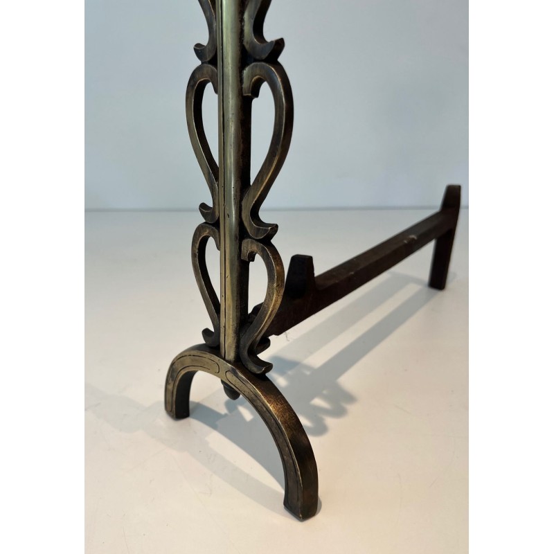 Pair of Brass and Iron Andirons with Stacked Scroll-Column Uprights on Arched Bases, in the Style of Raymond Subes