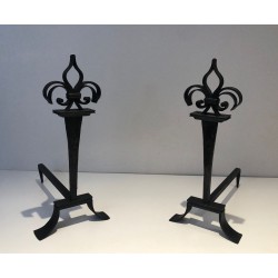 Important Pair of Wrought Iron Andirons with Heraldic Fleur-de-Lys Finials on Spreading Bases