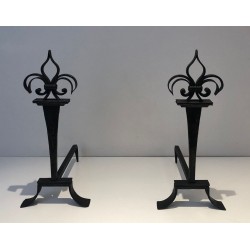 Important Pair of Wrought Iron Andirons with Heraldic Fleur-de-Lys Finials on Spreading Bases