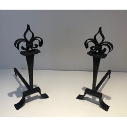 Important Pair of Wrought Iron Andirons with Heraldic Fleur-de-Lys Finials on Spreading Bases