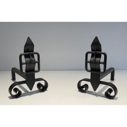 Pair of Wrought Iron Andirons with Obelisk Finials and Belt-and-Buckle Motifs on Scrolled Bases