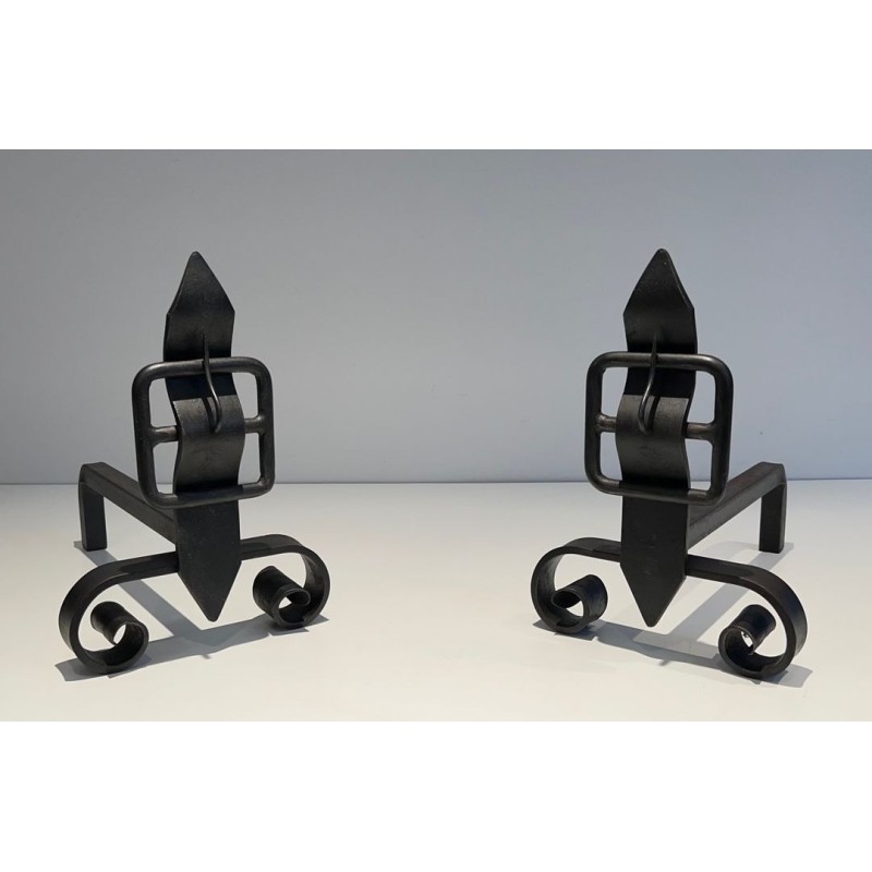 Pair of Wrought Iron Andirons with Obelisk Finials and Belt-and-Buckle Motifs on Scrolled Bases
