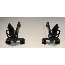 Pair of Wrought Iron Andirons with Obelisk Finials and Belt-and-Buckle Motifs on Scrolled Bases