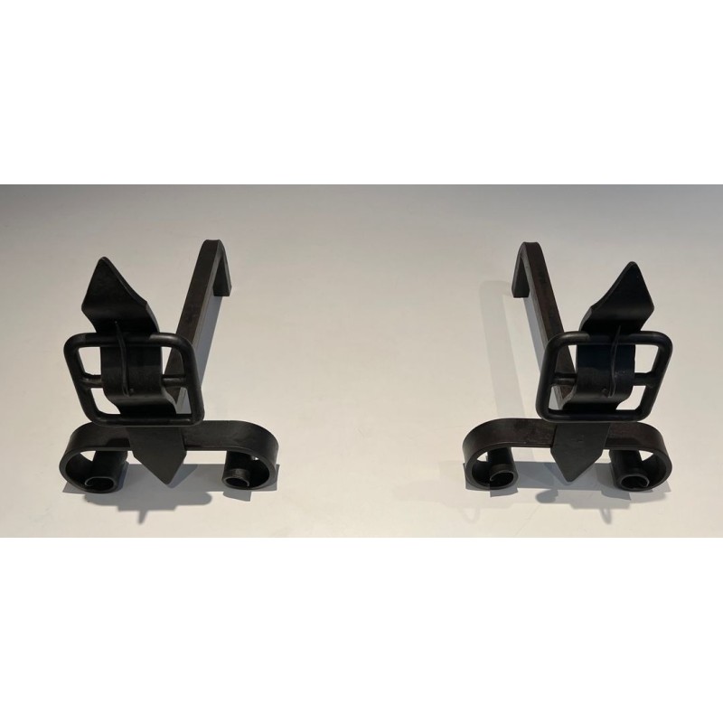 Pair of Wrought Iron Andirons with Obelisk Finials and Belt-and-Buckle Motifs on Scrolled Bases