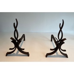 Pair of Wrought Iron Andirons with Stylised Flamboyant Uprights and Scrolled Feet, by Raymond Subes
