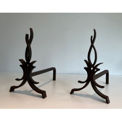 Pair of Wrought Iron Andirons with Stylised Flamboyant Uprights and Scrolled Feet, by Raymond Subes
