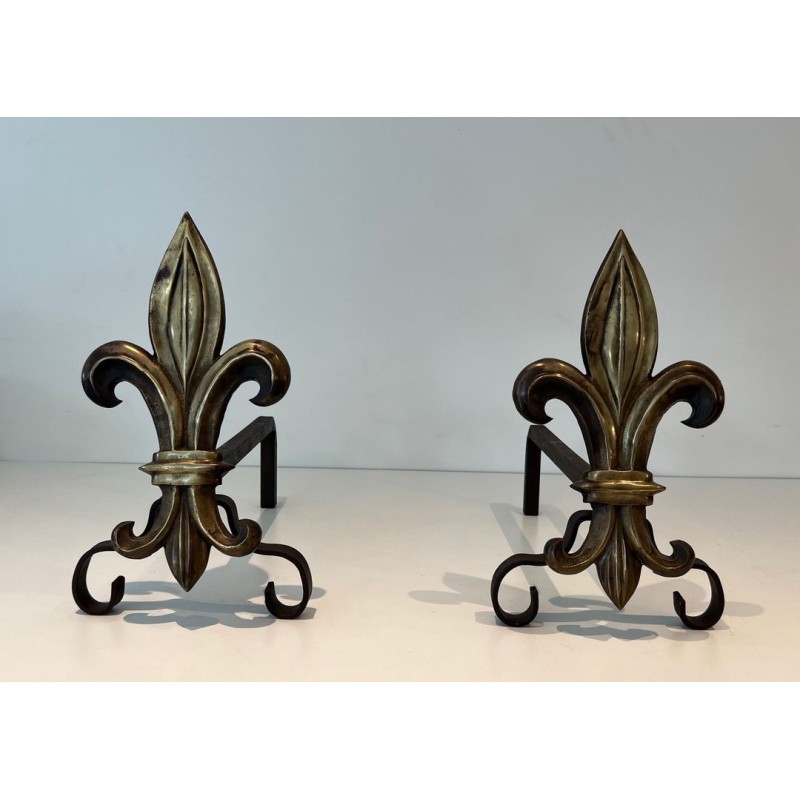 Pair of Bronze and Wrought Iron Andirons with Fleur-de-Lys Uprights. France. Circa 1940.