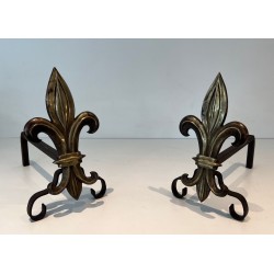 Pair of Bronze and Wrought Iron Andirons with Fleur-de-Lys Uprights. France. Circa 1940.
