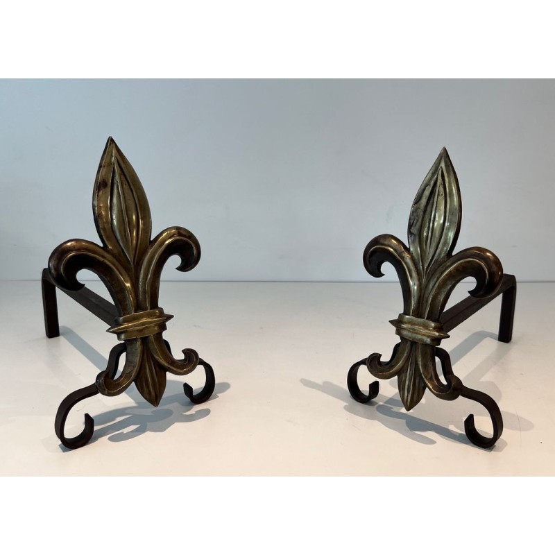 Pair of Bronze and Wrought Iron Andirons with Fleur-de-Lys Uprights. France. Circa 1940.