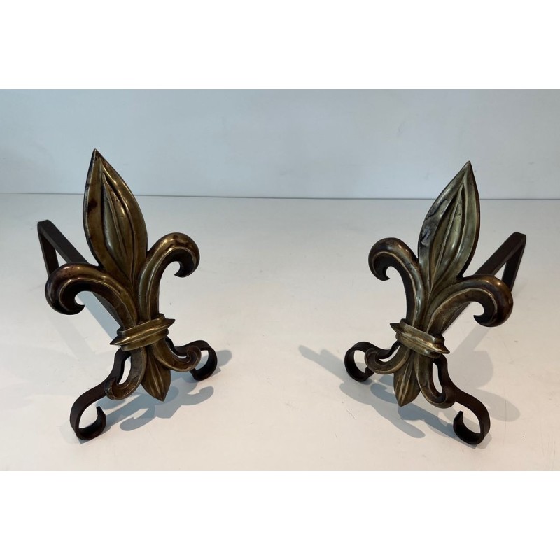 Pair of Bronze and Wrought Iron Andirons with Fleur-de-Lys Uprights. France. Circa 1940.