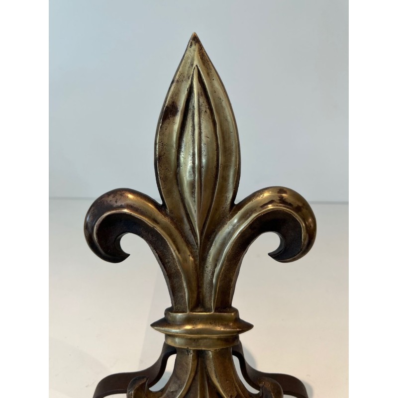Pair of Bronze and Wrought Iron Andirons with Fleur-de-Lys Uprights. France. Circa 1940.