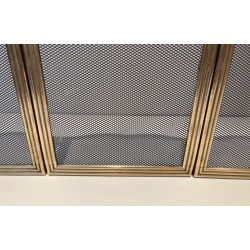 Neoclassical Style Four-Panel Brass and Steel Mesh Fireplace Screen with Scalloped Crest Rails. France. Circa 1970.