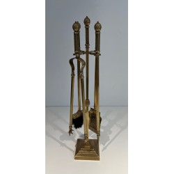 Neoclassical Style Finely Chased Bronze and Brass Fireplace Companion Set with Reticulated Ball Finials. France. Circa 1930.