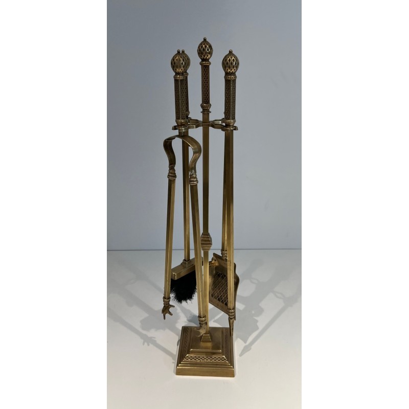 Neoclassical Style Finely Chased Bronze and Brass Fireplace Companion Set with Reticulated Ball Finials. France. Circa 1930.