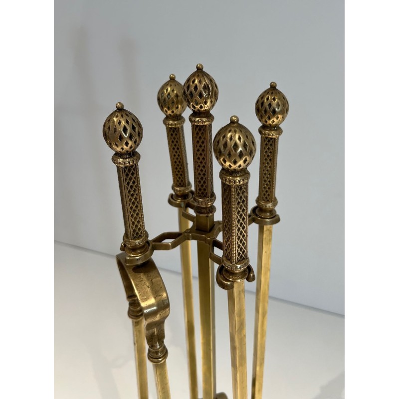 Neoclassical Style Finely Chased Bronze and Brass Fireplace Companion Set with Reticulated Ball Finials. France. Circa 1930.