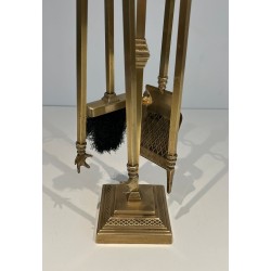 Neoclassical Style Finely Chased Bronze and Brass Fireplace Companion Set with Reticulated Ball Finials. France. Circa 1930.