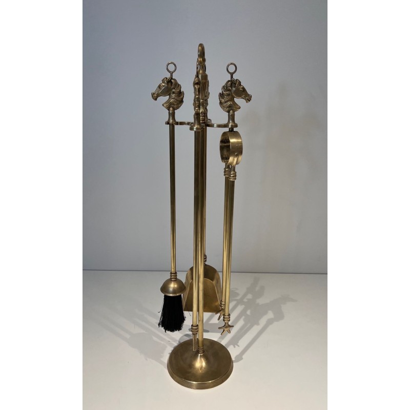 Neoclassical Style Brass Fireplace Companion Set with Horse Head Finials, in the Manner of Maison Jansen. France. Circa 1950.