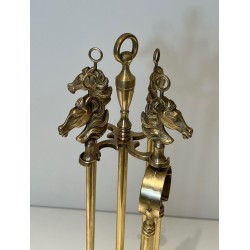 Neoclassical Style Brass Fireplace Companion Set with Horse Head Finials, in the Manner of Maison Jansen. France. Circa 1950.