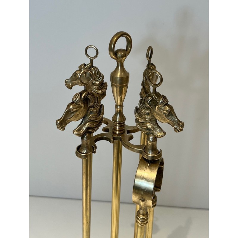 Neoclassical Style Brass Fireplace Companion Set with Horse Head Finials, in the Manner of Maison Jansen. France. Circa 1950.
