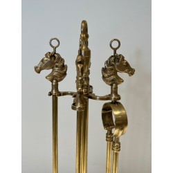 Neoclassical Style Brass Fireplace Companion Set with Horse Head Finials, in the Manner of Maison Jansen. France. Circa 1950.