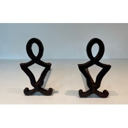 Pair of Modernist Cast Iron Andirons with Stylised Figural Uprights, by Raymond Subes. France. Circa 1940.