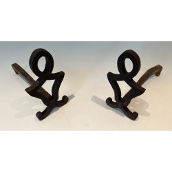 Pair of Modernist Cast Iron Andirons with Stylised Figural Uprights, by Raymond Subes. France. Circa 1940.