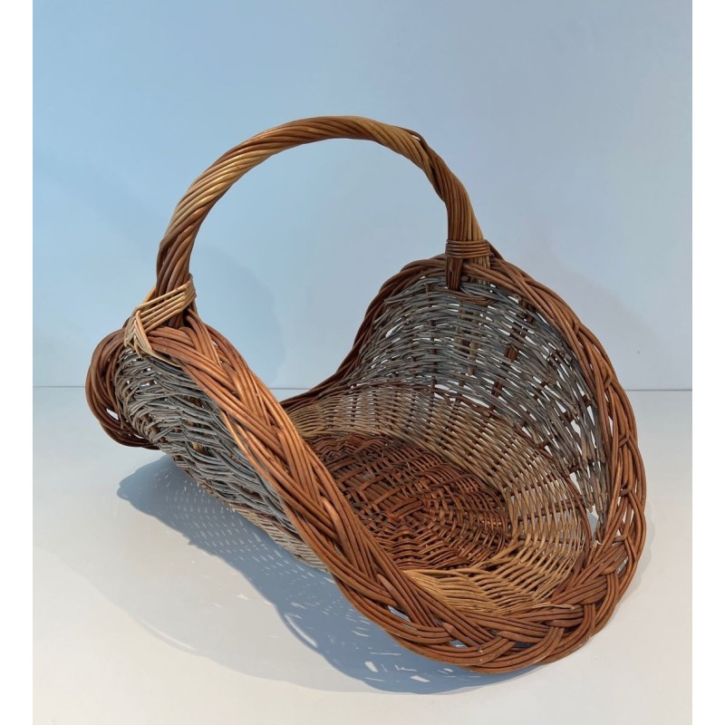 Rattan Wicker Log Basket of Boat Form with Arched Carrying Handle. France. Circa 1970.