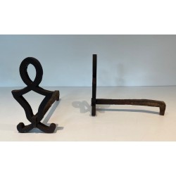 Pair of Modernist Cast Iron Andirons with Stylised Figural Uprights, by Raymond Subes. France. Circa 1940.