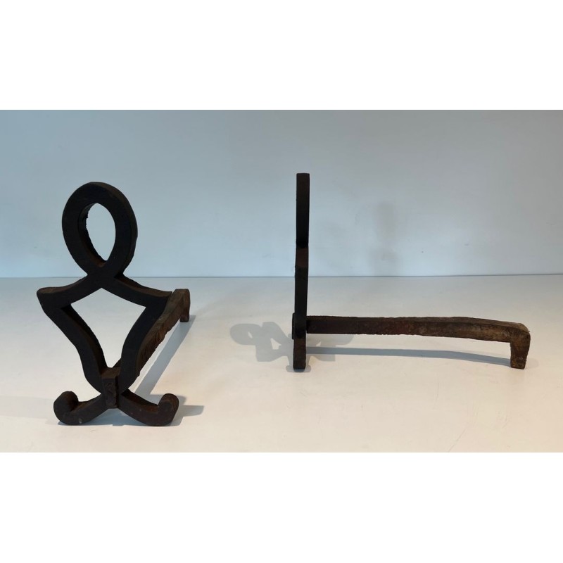 Pair of Modernist Cast Iron Andirons with Stylised Figural Uprights, by Raymond Subes. France. Circa 1940.