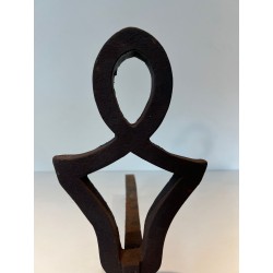 Pair of Modernist Cast Iron Andirons with Stylised Figural Uprights, by Raymond Subes. France. Circa 1940.