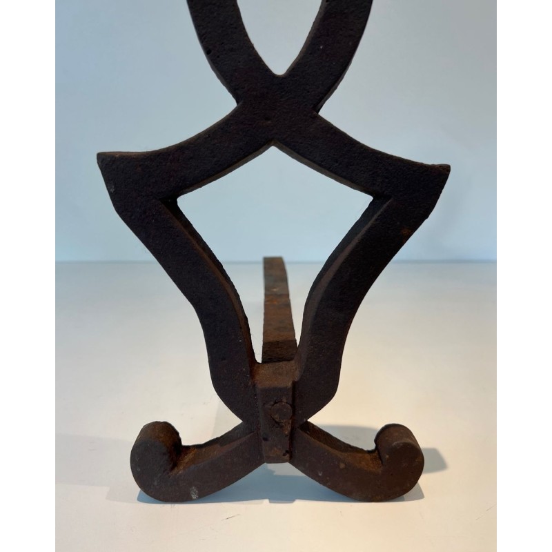 Pair of Modernist Cast Iron Andirons with Stylised Figural Uprights, by Raymond Subes. France. Circa 1940.
