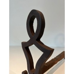 Pair of Modernist Cast Iron Andirons with Stylised Figural Uprights, by Raymond Subes. France. Circa 1940.