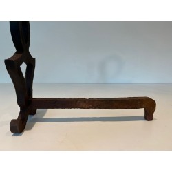 Pair of Modernist Cast Iron Andirons with Stylised Figural Uprights, by Raymond Subes. France. Circa 1940.