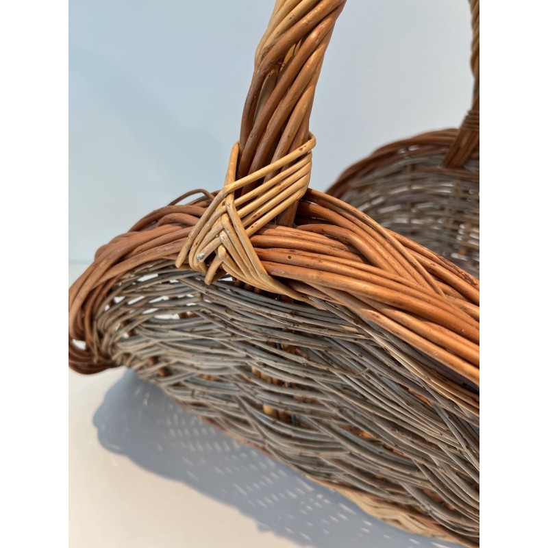 Rattan Wicker Log Basket of Boat Form with Arched Carrying Handle. France. Circa 1970.