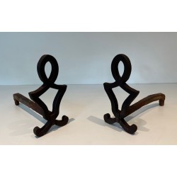 Pair of Modernist Cast Iron Andirons with Stylised Figural Uprights, by Raymond Subes. France. Circa 1940.