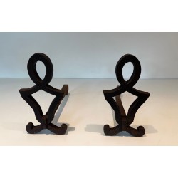 Pair of Modernist Cast Iron Andirons with Stylised Figural Uprights, by Raymond Subes. France. Circa 1940.