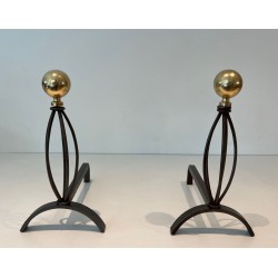 Pair of Modernist Wrought Iron and Brass Andirons with Ball Finials and Oval Cage Uprights. France. Circa 1970.