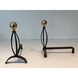 Pair of Modernist Wrought Iron and Brass Andirons with Ball Finials and Oval Cage Uprights. France. Circa 1970.