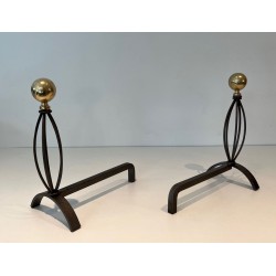 Pair of Modernist Wrought Iron and Brass Andirons with Ball Finials and Oval Cage Uprights. France. Circa 1970.
