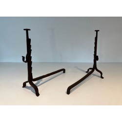 Pair of Wrought Iron Andirons with Ratchet Uprights and Tripod Bases. France. Circa 1900.