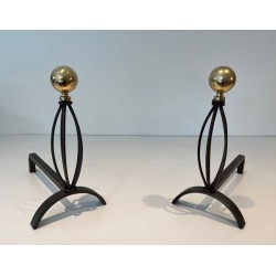 Pair of Modernist Wrought Iron and Brass Andirons with Ball Finials and Oval Cage Uprights. France. Circa 1970.