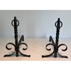 Pair of Neoclassical Wrought Iron Andirons with Twisted Column Uprights, Ring Finials and Scrolled Feet. France. Circa 1920.