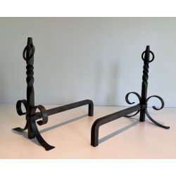 Pair of Neoclassical Wrought Iron Andirons with Twisted Column Uprights, Ring Finials and Scrolled Feet. France. Circa 1920.