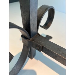 Pair of Neoclassical Wrought Iron Andirons with Twisted Column Uprights, Ring Finials and Scrolled Feet. France. Circa 1920.