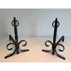 Pair of Neoclassical Wrought Iron Andirons with Twisted Column Uprights, Ring Finials and Scrolled Feet. France. Circa 1920.
