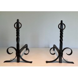 Pair of Neoclassical Wrought Iron Andirons with Twisted Column Uprights, Ring Finials and Scrolled Feet. France. Circa 1920.