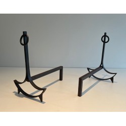 Pair of Wrought Iron Andirons with Ring Finials and Swept Crescent Bases. France. Circa 1940.