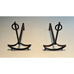 Pair of Wrought Iron Andirons with Ring Finials and Swept Crescent Bases. France. Circa 1940.