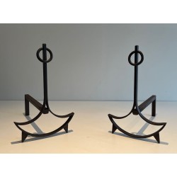 Pair of Wrought Iron Andirons with Ring Finials and Swept Crescent Bases. France. Circa 1940.